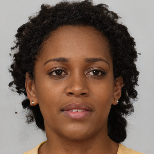 Neutral black young-adult female with long  brown hair and brown eyes
