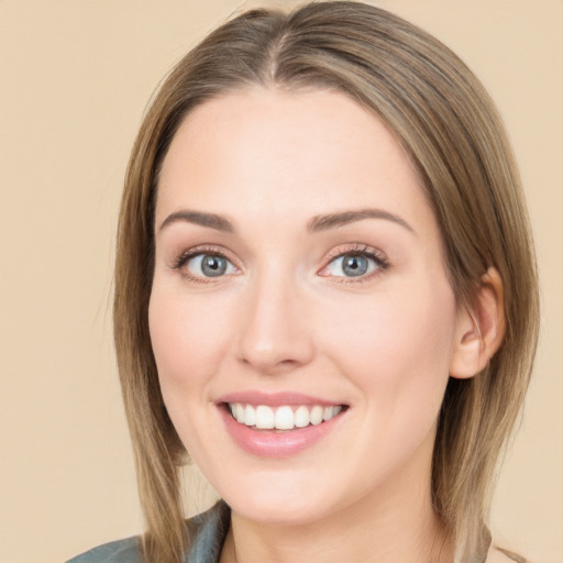 Joyful white young-adult female with medium  brown hair and green eyes