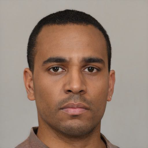 Neutral latino young-adult male with short  brown hair and brown eyes