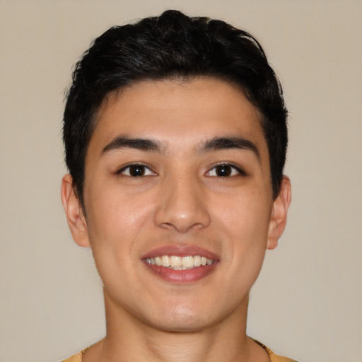 Joyful latino young-adult male with short  brown hair and brown eyes