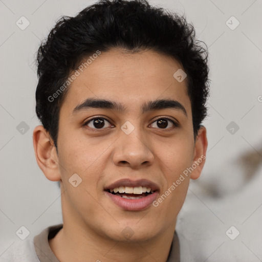 Joyful latino young-adult male with short  brown hair and brown eyes