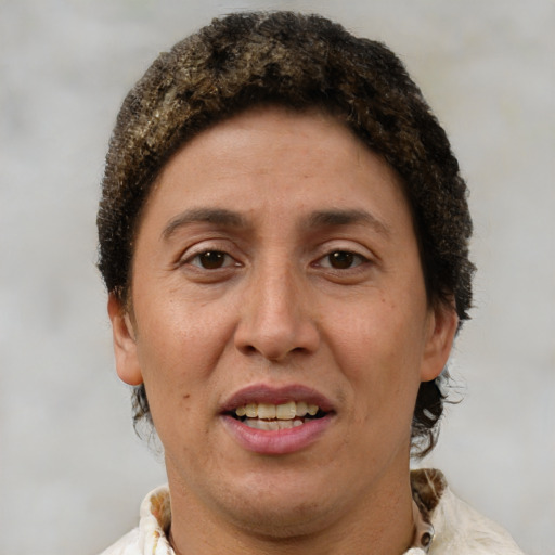 Joyful white adult female with short  brown hair and brown eyes