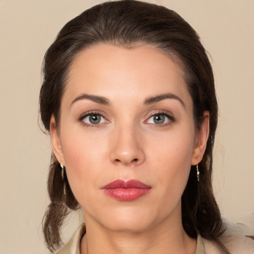 Joyful white young-adult female with medium  brown hair and brown eyes