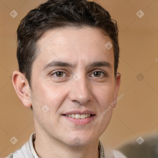 Joyful white adult male with short  brown hair and brown eyes