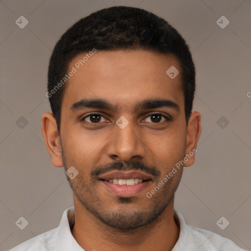 Joyful latino young-adult male with short  black hair and brown eyes