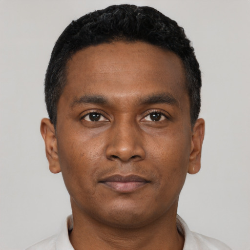 Neutral black young-adult male with short  black hair and brown eyes