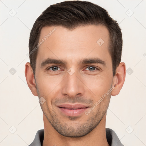 Joyful white young-adult male with short  brown hair and brown eyes