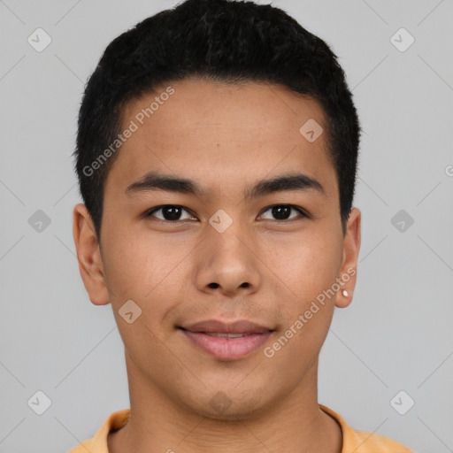 Joyful asian young-adult male with short  brown hair and brown eyes