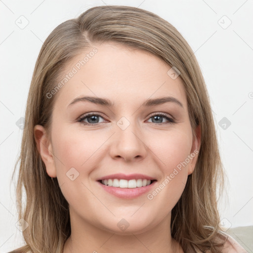 Joyful white young-adult female with long  brown hair and grey eyes