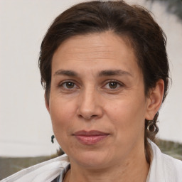 Joyful white adult female with short  brown hair and brown eyes