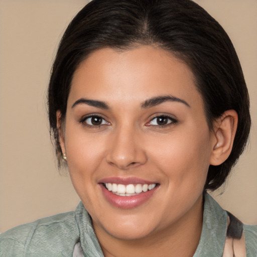 Joyful white young-adult female with medium  brown hair and brown eyes