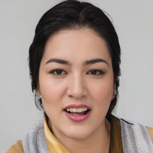 Joyful asian young-adult female with medium  black hair and brown eyes