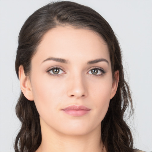 Neutral white young-adult female with long  brown hair and brown eyes