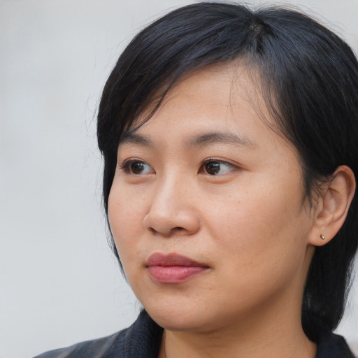 Neutral asian young-adult female with medium  black hair and brown eyes