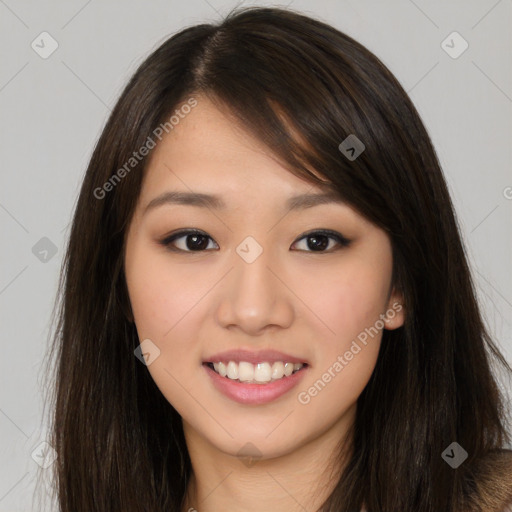 Joyful asian young-adult female with long  brown hair and brown eyes