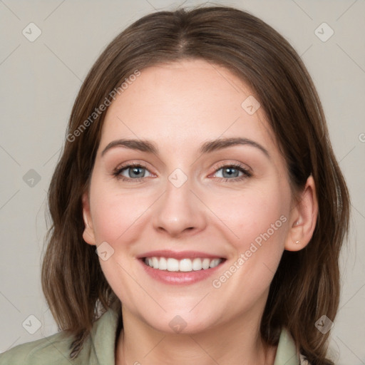 Joyful white young-adult female with medium  brown hair and green eyes