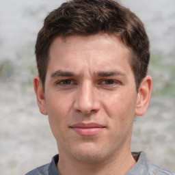 Joyful white adult male with short  brown hair and grey eyes