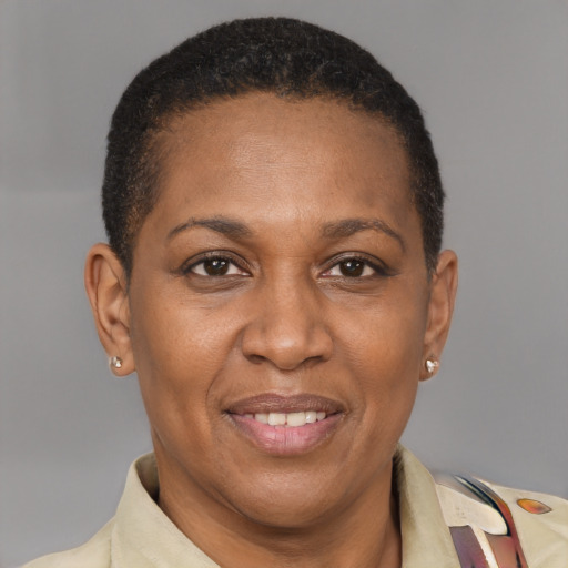 Joyful latino adult female with short  brown hair and brown eyes