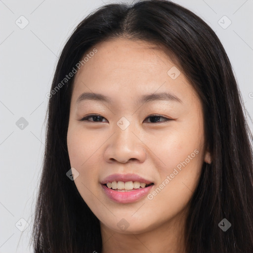 Joyful asian young-adult female with long  brown hair and brown eyes