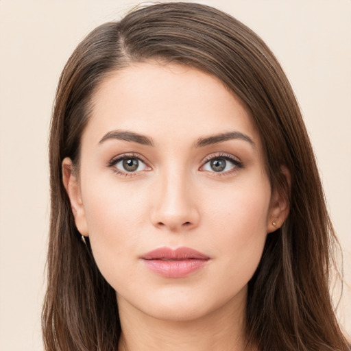 Neutral white young-adult female with long  brown hair and brown eyes