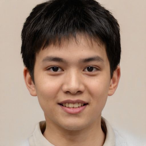 Joyful white child male with short  brown hair and brown eyes
