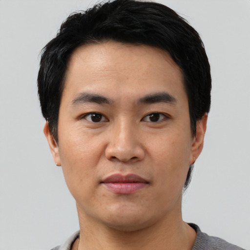 Neutral asian young-adult male with short  black hair and brown eyes