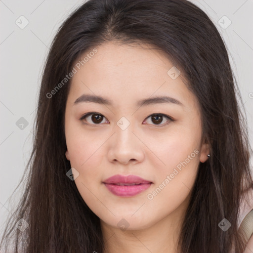 Joyful asian young-adult female with long  brown hair and brown eyes