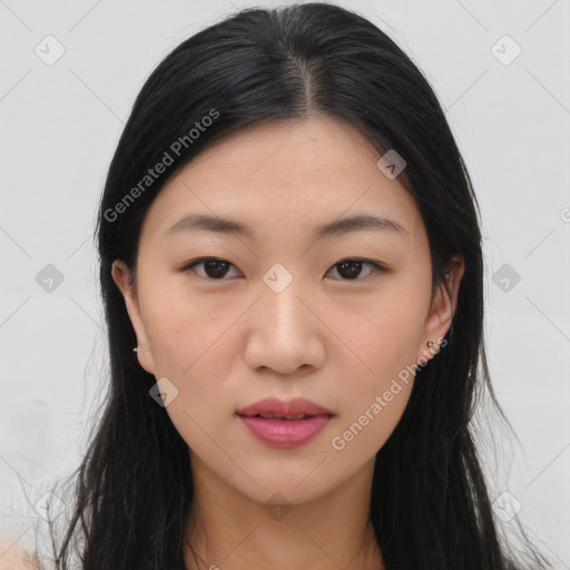 Joyful asian young-adult female with long  brown hair and brown eyes