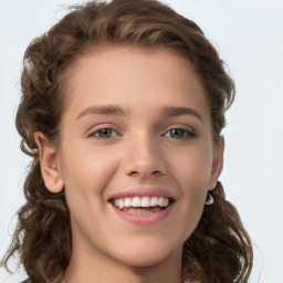 Joyful white young-adult female with long  brown hair and green eyes