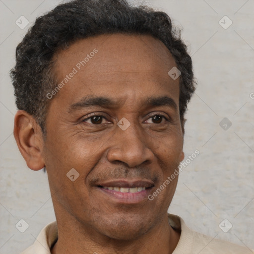 Joyful black adult male with short  brown hair and brown eyes