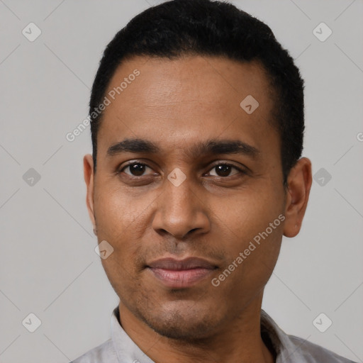 Joyful black young-adult male with short  black hair and brown eyes