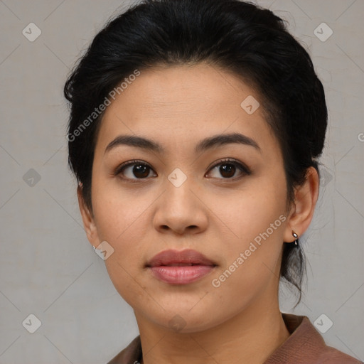 Joyful asian young-adult female with medium  black hair and brown eyes