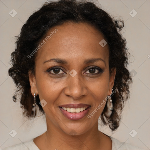 Joyful black adult female with medium  brown hair and brown eyes