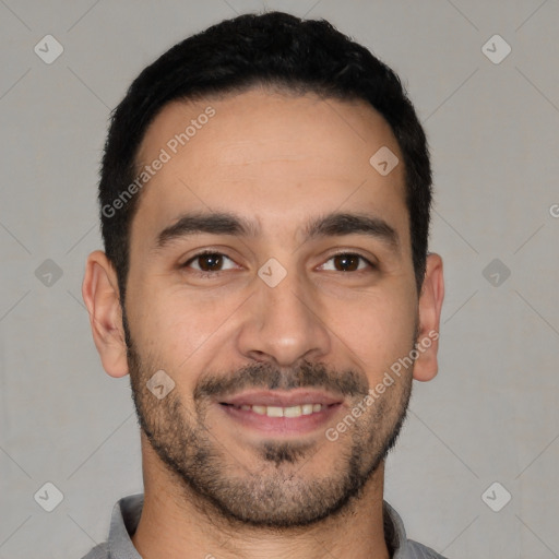 Joyful white young-adult male with short  black hair and brown eyes