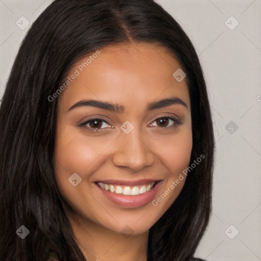 Joyful latino young-adult female with long  brown hair and brown eyes