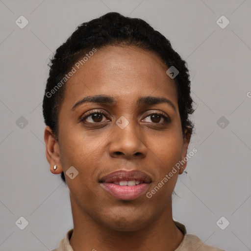 Joyful black young-adult female with short  black hair and brown eyes