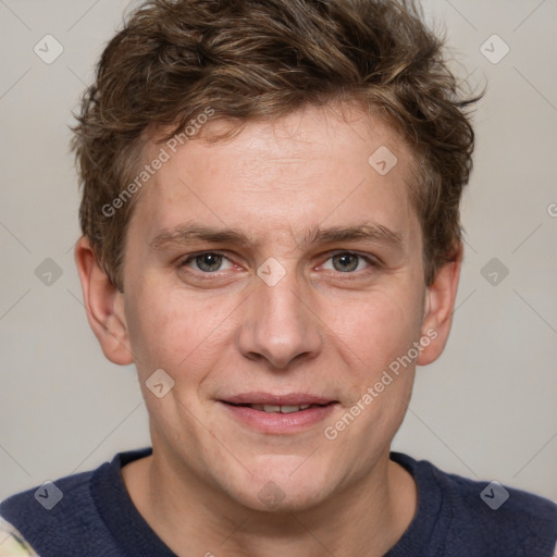 Joyful white adult male with short  brown hair and grey eyes