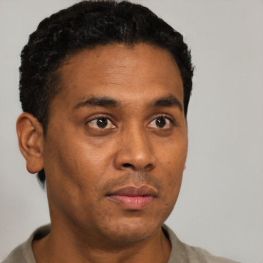 Neutral black young-adult male with short  brown hair and brown eyes