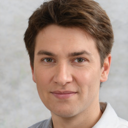 Joyful white adult male with short  brown hair and grey eyes