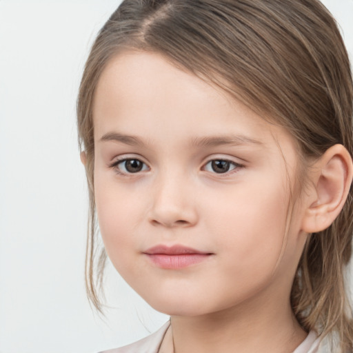 Joyful white child female with medium  brown hair and brown eyes