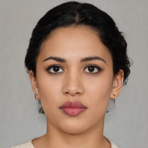 Neutral latino young-adult female with medium  black hair and brown eyes