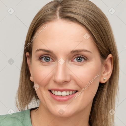 Joyful white young-adult female with long  brown hair and blue eyes