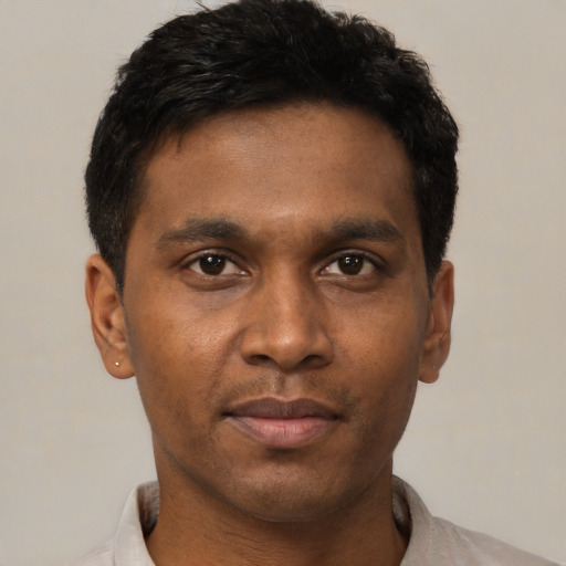 Neutral black young-adult male with short  black hair and brown eyes
