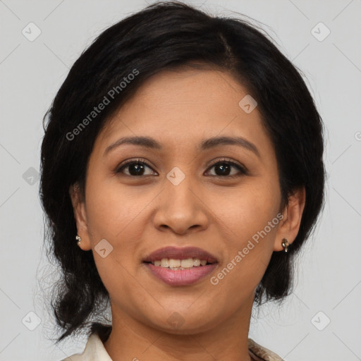 Joyful latino adult female with medium  brown hair and brown eyes