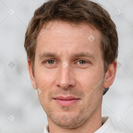 Joyful white adult male with short  brown hair and grey eyes