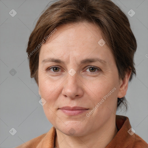 Joyful white adult female with short  brown hair and grey eyes