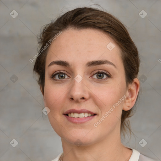 Joyful white young-adult female with medium  brown hair and grey eyes