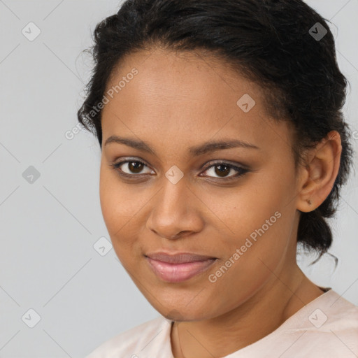 Joyful black young-adult female with medium  brown hair and brown eyes