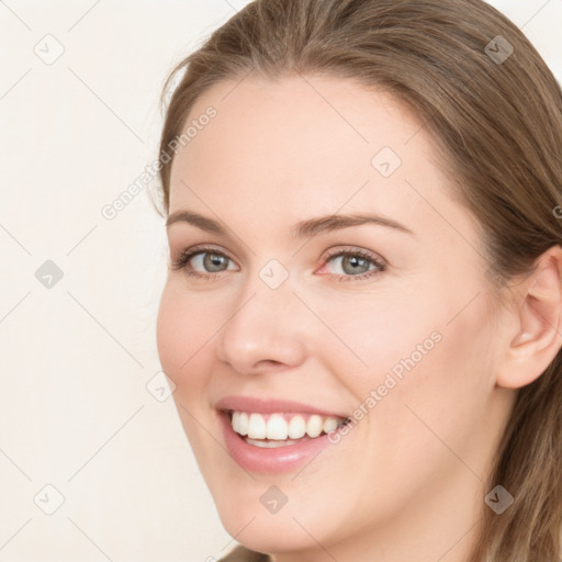 Joyful white young-adult female with long  brown hair and blue eyes