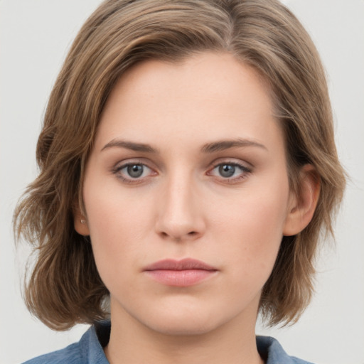 Neutral white young-adult female with medium  brown hair and grey eyes